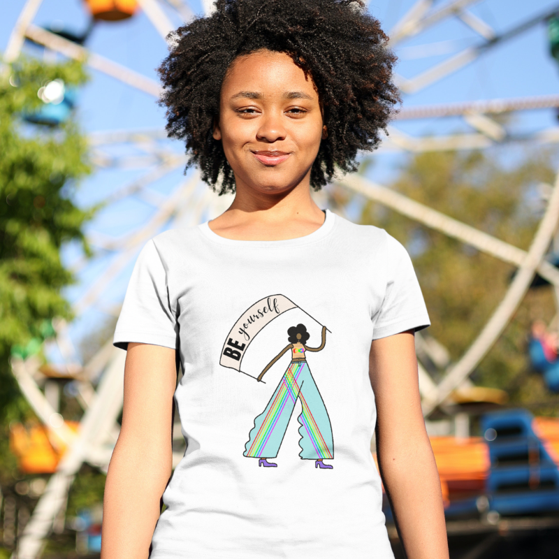 Teenage girl wearing a T-shirt, standing in front of a Ferris wheel