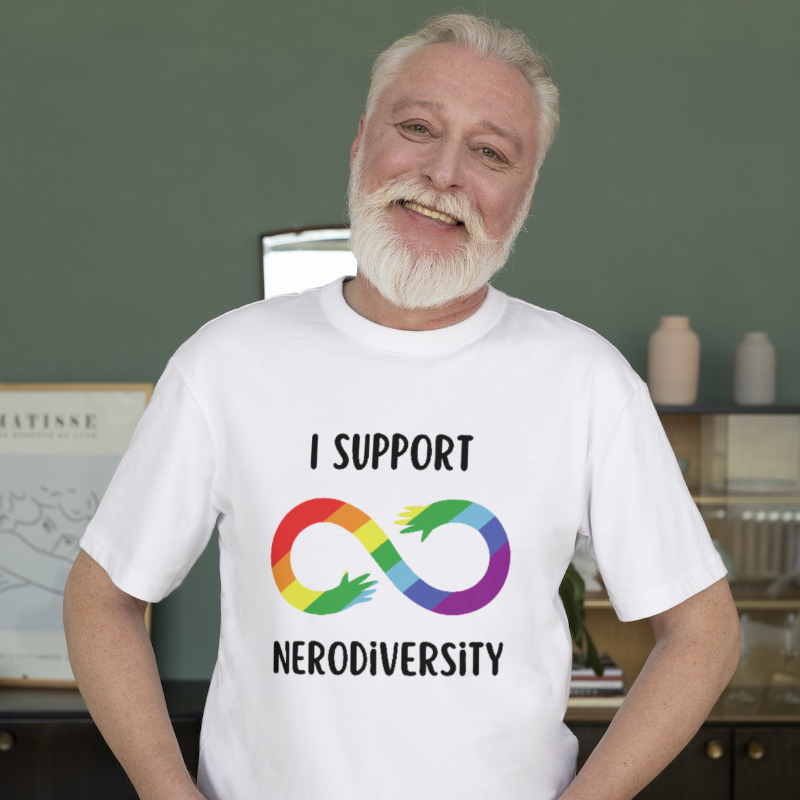 Man with gray Hair in a t-shirt that says I Support Neurodiversity